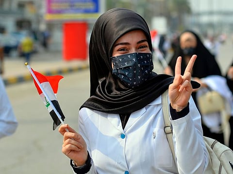 An Iraqi medical student takes part in an anti-government demonstration in the central holy shrine city of Najaf on October 28, 2019.