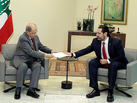 Lebanon's Prime Minister Saad Al Hariri hands over his resignation letter to Lebanon's President Michel Aoun at the Baabda Palace, in Baabda Lebanon October 29, 2019. 