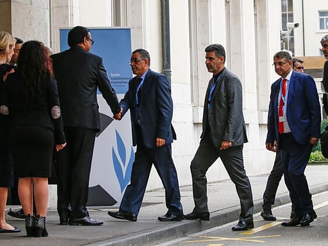Members of the Syrian opposition arrive at the UN for the first meeting of the Syrian Constitutional Committee in Geneva on Wednesday.