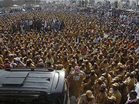 Supporters of Pakistani cleric Maulana Fazlur Rahman, head of the Jamiat Ulema-e-Islam, listen to their leaders in Multan, Pakistan, Tuesday.