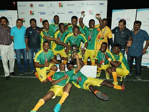 Drydocks World Dubai celebrate with the trophy after winning the inaugural edition of the Maritime Premier Football League.