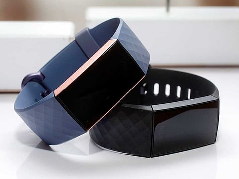 The Fitbit Charge 3 fitness trackers are displayed in New York. Google’s parent company is buying wearable device maker Fitbit for about $2.1 billion. Alphabet said Friday, Nov. 1, 2019, that it will pay $7.35 per share. 