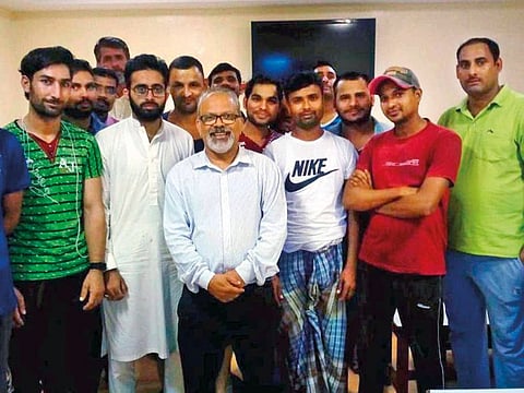 Abdullah Padiyath (centre) with workers at an accommodation in Jebel Ali. Padiyath’s most cherished memories are of construction workers enjoying out-of-office life.