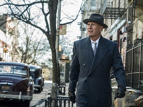 This image released by Warner Bros. shows Bruce Willis in a scene from "Motherless Brooklyn." (Glen Wilson/Warner Bros. Pictures via AP)