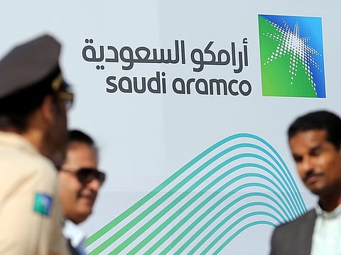 The logo of Aramco is seen as security personnel stand before the start of a press conference by Aramco at the Plaza Conference Center in Dhahran, Saudi Arabia November 3, 2019. 
