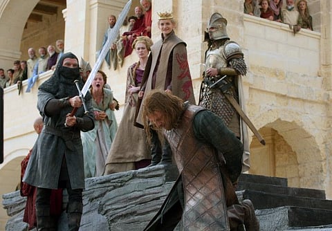 This image released by HBO shows Sean Bean, foreground, and Sophie Turner, background from second left, Lena Headey and Jack Gleeson in a scene from the first season of "Game of Thrones." HBO is green-lighting a new "Game of Thrones" prequel after reportedly canceling another that starred Naomi Watts. The cable channel said Tuesday, Oct. 29, 2019, that it's given a 10-episode order to "House of the Dragon," set 300 years before the original series that ended its eight-season run in May. (HBO via AP)