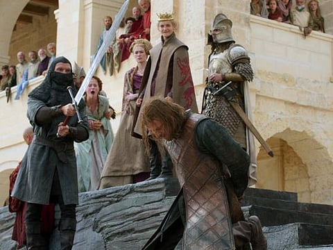 This image released by HBO shows Sean Bean, foreground, and Sophie Turner, background from second left, Lena Headey and Jack Gleeson in a scene from the first season of "Game of Thrones." HBO is green-lighting a new "Game of Thrones" prequel after reportedly canceling another that starred Naomi Watts. The cable channel said Tuesday, Oct. 29, 2019, that it's given a 10-episode order to "House of the Dragon," set 300 years before the original series that ended its eight-season run in May. (HBO via AP)