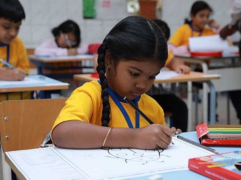A young participant shows her artistic flair at the national art competition in Dubai