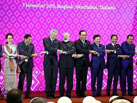 India's Prime Minister Narendra Modi shares a laugh with Singapore Prime Minister Lee Hsien Loong at the ASEAN-India Summit in Bangkok, Thailand.