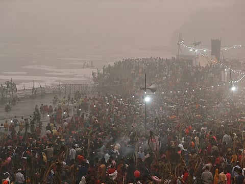 Hindu devotees worship the Sun deity in the polluted waters of the river Yamuna during the Hindu religious festival of Chatth Puja in New Delhi on November 3.