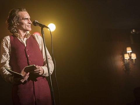 This image released by Warner Bros. Pictures shows Joaquin Phoenix in a scene from the film "Joker." (Niko Tavernise/Warner Bros. Pictures via AP)