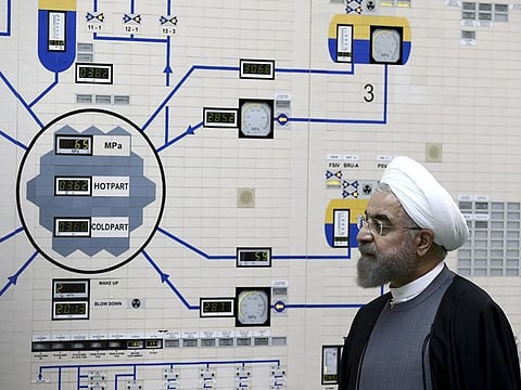 In this January 13, 2015, file photo, President Hassan Rouhani visits the Bushehr nuclear power plant. Iran announced Tuesday it would inject uranium gas into 1,044 centrifuges it previously kept empty under its 2015 nuclear deal with world powers. 