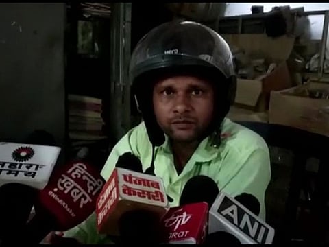 Employees of electricity dept wear helmets to protect themselves from any untoward incident while working in dilapidated office building.