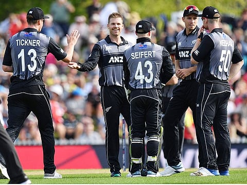 New Zealand's Lockie Ferguson (C) celebrates with teammates after bowling England's Lewis Gregory during the Twenty20 cricket match at Saxton Oval in Nelson on November 5, 2019. 