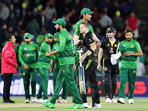 Steve Smith (C) of Australia shakes hands with Pakistan's Mohammad Irfan after the second Twenty20 match at the Manuka Oval in Canberra on November 5, 2019.  