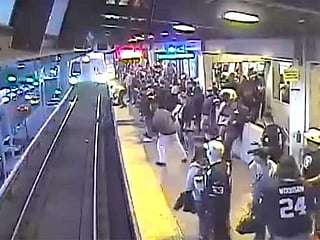 Video shows worker saving man as speeding train approached