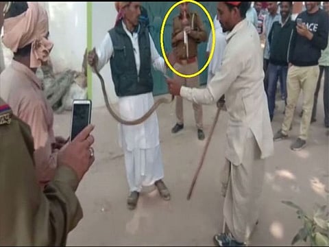 A cop at Himpurdeepa police station caught on camera while playing Pungi.