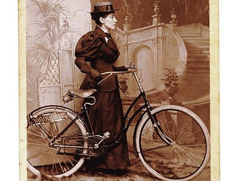 An image in the public domain shows a cabinet card of Annie Kopchovsky, better known as Annie Londonderry, who set out in her early 20s to bicycle around the world. Kopchovsky, a Latvian immigrant who in June 1894, at about age 23, cycled away from her Boston home, leaving a husband and three small children, for a journey around the world that came to symbolize women’s independence. She died of a stroke on Nov. 11, 1947. 