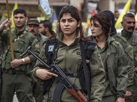 Members of the Kurdish Internal Security Police Forces of Asayesh take part in a demonstration against Turkish threats in the northeastern city of Qamishli, the de-facto capital of Syria's embattled Kurdish minority, on November 2, 2019. 