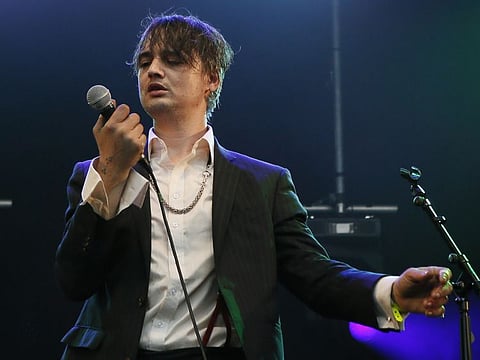FILE - In this May 4, 2017 file photo, British musician Pete Doherty performs on stage during a concert in Paris.