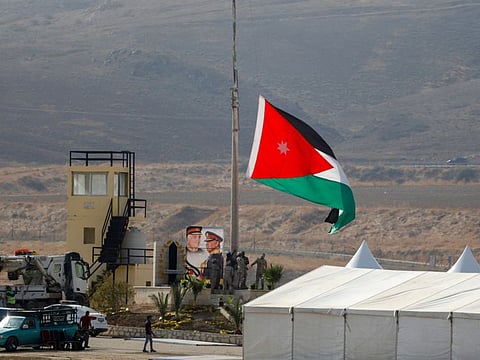 Jordanian soldiers raise the national flag ahead of a ceremony at the Jordan Valley site of Baqura in Jordan.