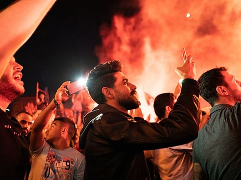 Wael Zorkot, 24, films a protest in Beirut. Frustration over political and economic conditions in Lebanon has led to increasing unrest. 