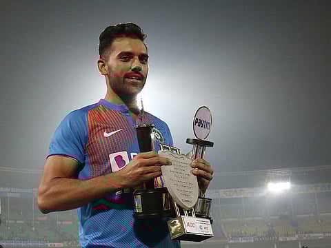 India's Deepak Chahar with the Player of the Match and Tournament trophies.