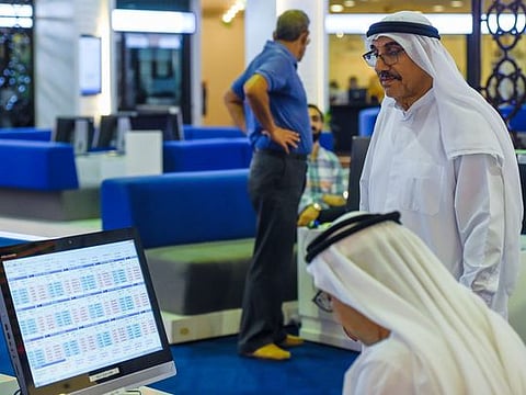 Traders at Dubai Financial Market. As markets plunge into uncertainty amid nearing US elections and a second wave of surging COVID-19 infections worldwide, investors were bracing themselves for a bumpy ride.
