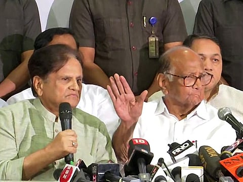 NCP Chief Sharad Pawar and Congress leader Ahmad Patel hold a joint press conference after meeting, in Mumbai on Tuesday. 