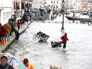 Photos: Record high tide hits flooded Venice