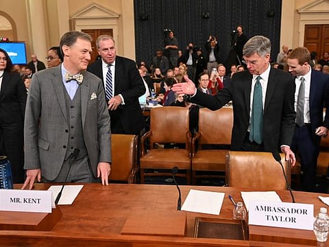Ambassador Bill Taylor, charge d'affaires at the US embassy in Ukraine; and George Kent, deputy assistant secretary of state for European Affairs, take their seats at the US House Intelligence Committee hearing as part of Trump impeachment inquiry 