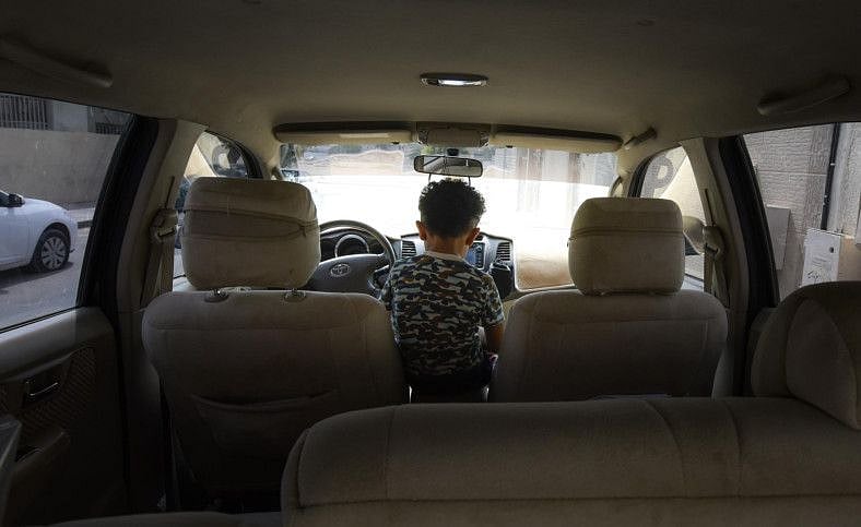 OPN 191115 kids in car-1573812229817