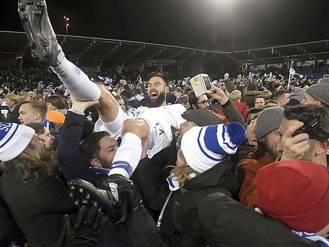 Finland players are chaired by their ecstatic fans after they qualified for Euro 2000 for the first time in history on Friday. 
