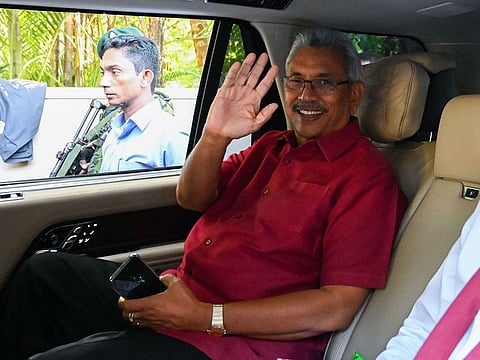 Sri Lanka's President-elect Gotabaya Rajaaksa waves from inside his car as he leaves his house to go to the election commission office in Colombo on November 17, 2019. 