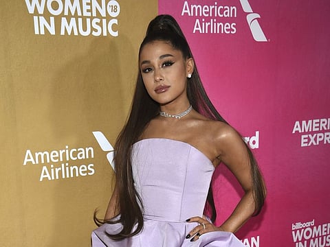 FILE - In this Dec. 6, 2018, file photo, Ariana Grande attends the 13th annual Billboard Women in Music event at Pier 36 in New York.