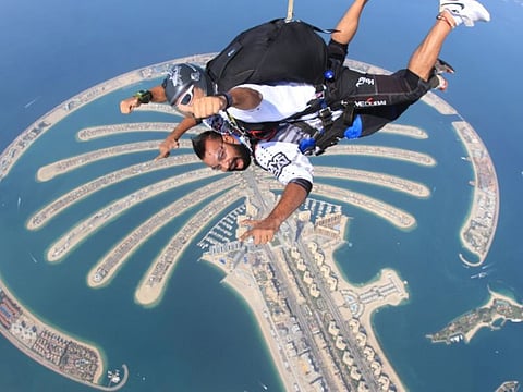When paraplegic Kalliyath Pahalisha from Kerala, who became wheelchair-bound after a road accident in 2009, fulfilled his dream of skydiving in Dubai. COURTESY Kalliyath Pahalisha