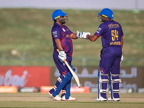 Deccan Gladiators opener Mohammad Shahzad (left) being congratulated by teammate Bhanuka Rajapaksa on reaching his half-century. 
