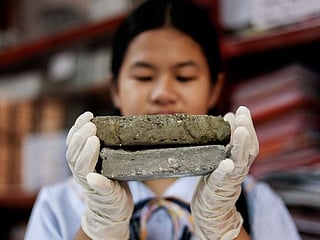 Philippine students turn littered dog poo into bricks 