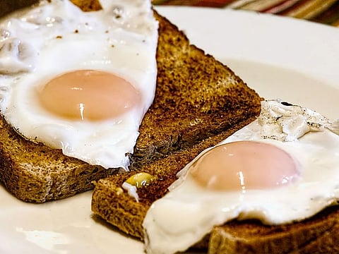 Fried eggs on toast. For illustrative purposes only.