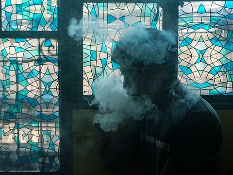 A customer smoking at a vape store in Manila on November 20, 2019.