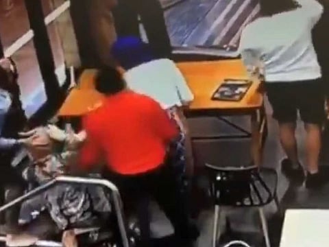 After several frenzied punches, the woman fell to the ground and was stamped on, before bystanders wrestled the assailant away. 