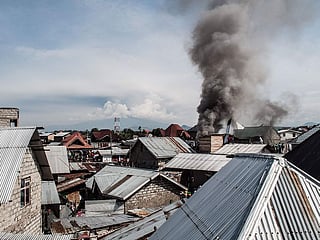 Smoke raises after a small aircraft carrying around 15 passengers crashed in a densely populated area in Goma on the East of the Democratic Republic of Congo on November 24, 2019. 
