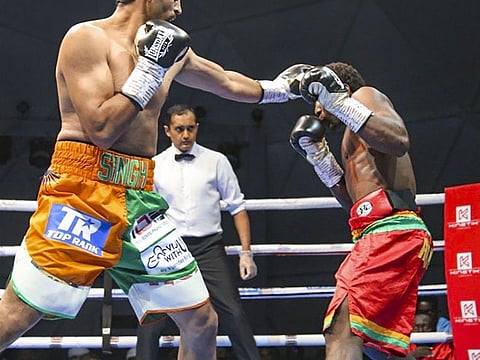 Indian boxing star Vijender Singh in a bout with Ghana’s former Commonwealth champion Charles Adamu during the Rotunda Rumble 2 in Dubai. 