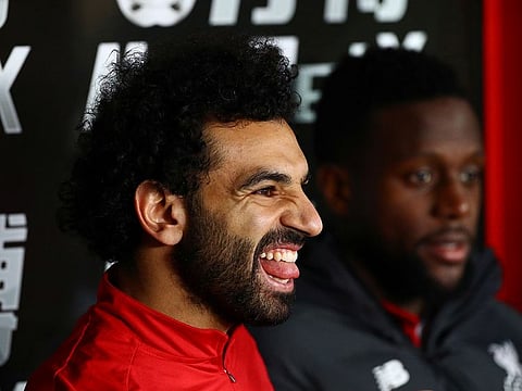 Liverpool's Mohamed Salah on the bench against Crystal Palace.