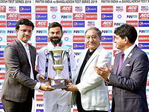 Indian board president Sourav Ganguly and his counterpart from Bangladesh hand the winners' trophy to skipper Virat Kohli after the Pink Ball Test at Eden Gardens in Kolkata last year.
