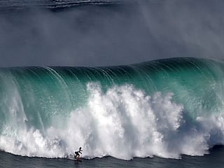 Pictures: Extreme surfers flock to Portugal’s Nazare to catch record waves