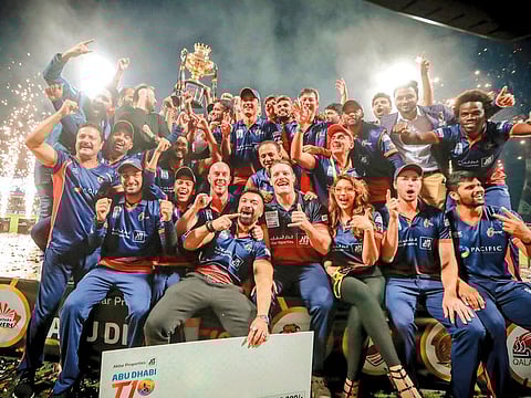 Maratha Arabians team members celebrate after winning the Aldar Abu Dhabi T10 League on Sunday night.
