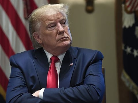 President Donald Trump listens during a meeting in the Cabinet Room of the White House in Washington, Friday, Nov. 22, 2019