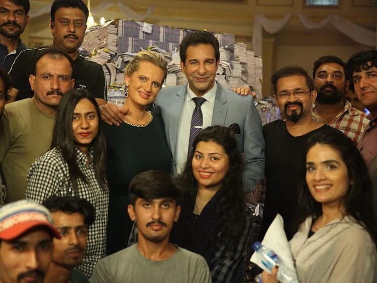 Shaneira and Waseem Akram, with the crew of MONEY BACK GUARANTEE-1574660578737