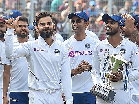 Indian captain Virat Kohli gives a thumbs up to cheering fans after winning the day-night Test series against Bangladesh, at Eden Gardens in Kolkata, on November 24, 2019. 